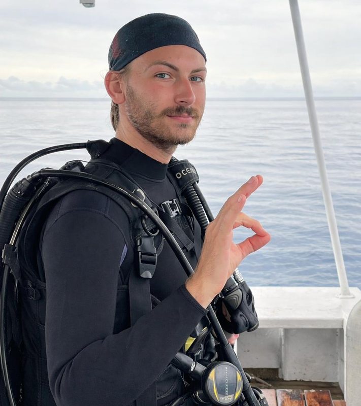 Portrait of Maxwell E. Miller in scuba equipment on the ocean